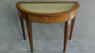 A 19th century Georgian style mahogany demi lune vitrine with glazed lift up lid. H.71 W.92 D.46cm