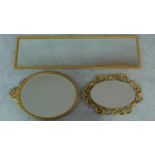 A rectangular gilt wall mirror and two oval gilt mirrors. 120x34cm