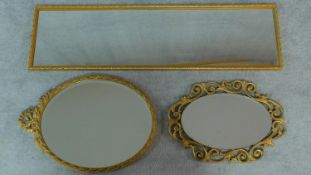 A rectangular gilt wall mirror and two oval gilt mirrors. 120x34cm