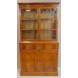 A Georgian style mahogany library bookcase, the upper glazed section above base fitted with