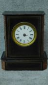 A late 19th century ebonised, brass and marble inlaid mantle clock. H.33cm (lacks glass and hands)