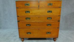 An early 19th century teak brass bound two section military campaign chest with brass inset