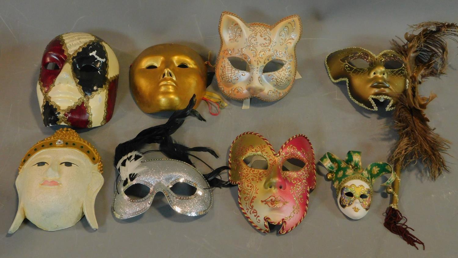 A collection of eight Venetian and other masks.