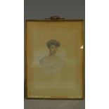 An early 20th century pencil and watercolour portrait in gilt metal easel frame. 30x21cm