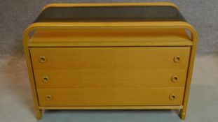 A vintage oak and plywood chest of three drawers with drop in smoked glass top. H.72 W.107 D.49cm