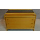 A vintage oak and plywood chest of three drawers with drop in smoked glass top. H.72 W.107 D.49cm