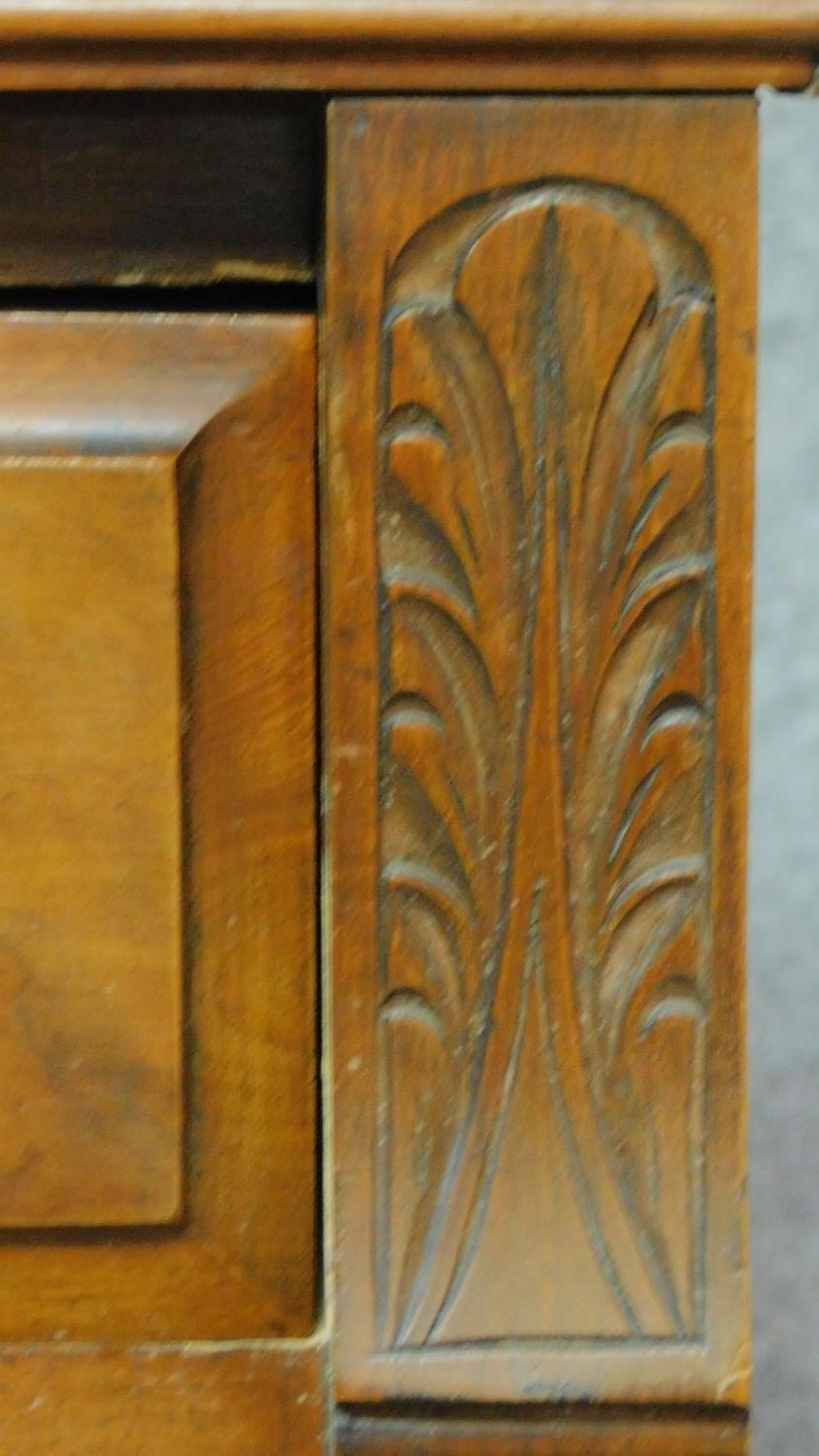 A late Victorian carved walnut sideboard fitted drawers and cupboards on bracket feet. H.94 W.137 - Image 4 of 8