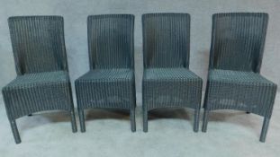 A set of four Lloyd Loom dining chairs, labels to back. H.95
