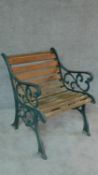 A wrought iron and teak slatted Coalbrookdale style garden bench. H.77cm