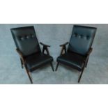 A pair of 1960's vintage Louis van Teeffelen teak framed armchairs restored and recovered in black