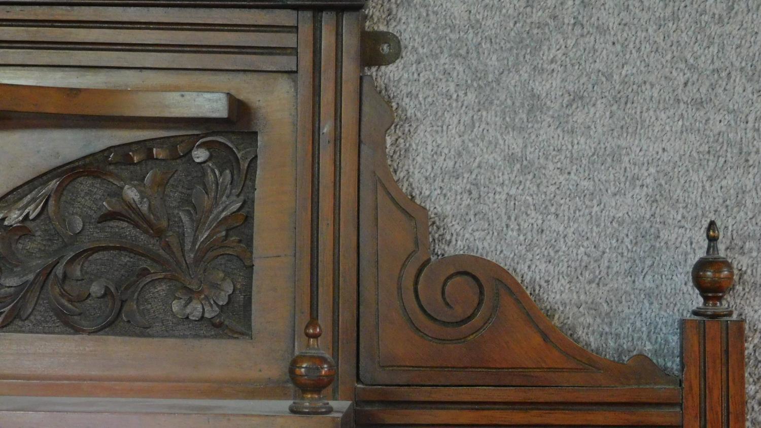 A Victorian carved walnut overmantel with broken arch pediment. H.135 W.111 D.16cm - Image 3 of 6