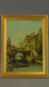 A gilt framed and glazed oil on board of a continental canal scene. 49x37cm