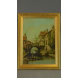 A gilt framed and glazed oil on board of a continental canal scene. 49x37cm