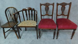 A pair of late Victorian carved walnut dining chairs, an Edwardian tub chair and a country stick