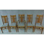 A set of five Arts and Crafts oak dining chairs stamped to base, including one armchair. H.108