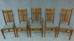 A set of five Arts and Crafts oak dining chairs stamped to base, including one armchair. H.108