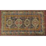 A Turkish rug with 4 pendant medallions surrounded by multiple geometric borders 180x100cm