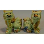 A pair of Chinese ceramic Fo dogs. H.14cm