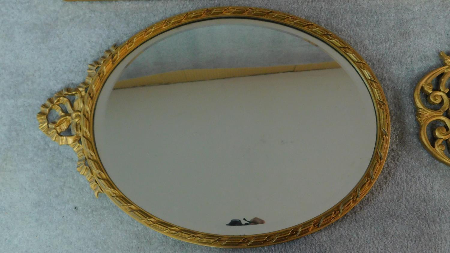 A rectangular gilt wall mirror and two oval gilt mirrors. 120x34cm - Image 3 of 5