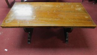 A continental oak refectory table with urn carved stretchered trestle ends. 76x150x72cm