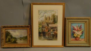 A framed and glazed watercolour, cathedral by a river, and two framed oil paintings, still life
