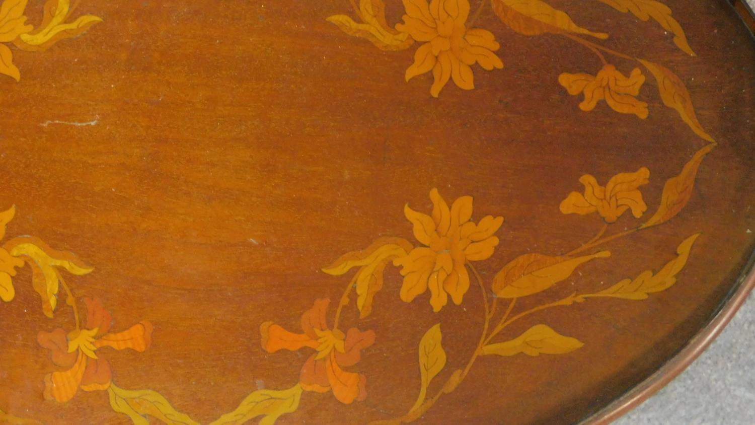A late 19th century oval mahogany and marquetry inlaid tray with twin brass carrying handles. W.67 - Image 2 of 5