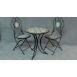 A pair of wrought iron mosaic inlaid garden chairs and a matching garden table. H.70 W.61 D.61cm (