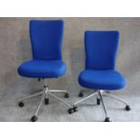 A pair of blue upholstered swivel chairs, Vitra label to base. H.102