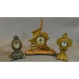 A shaped gilt metal mantel clock on marble base, an Art Nouveau mantel clock and another similar.