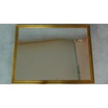A rectangular gilt framed mirror with bevelled plate. 84x109