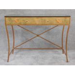 A gilt metal and glass topped console table with gilt and heraldry decorated fascia. H.77 W.102 D.