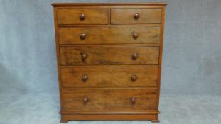 A Vicorian mahogany tall chest of drawers fitted two short over four long drawers with original knob
