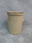 A stoneware bread bin with wooden bread board cover. H 36m