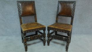 A pair of Carolean style oak framed leather studded and upholstered hall chairs. H.99cm