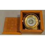 A boxed mariner's compass with Chinese astrological compass points. 13.cm x 13cm.