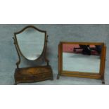 A Georgian style mahogany swing mirror with fitted base and a similar Edwardian oak mirror. H.64cm