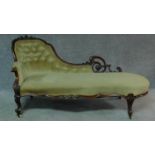 A Victorian carved mahogany framed chaise longue in sage buttoned upholstery on cabriole supports