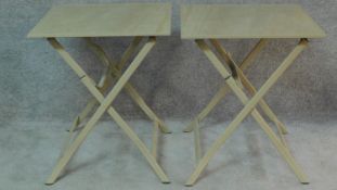 A pair of metal and ceramic tiled folding garden tables. H.74 W.63 D.63cm