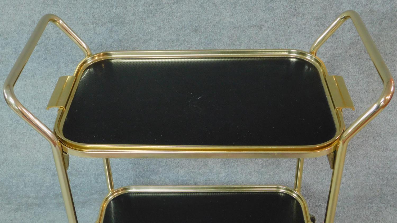 A 1970's vintage gilt metal two tier drinks trolley. H.81 W.70 D.38cm - Image 2 of 3