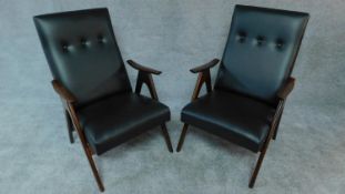 A pair of 1960's vintage Louis van Teeffelen teak framed armchairs restored and recovered in black