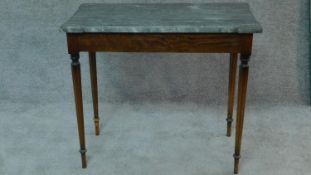 A 19th century style continental birch console table with shaped marble top on reeded tapering