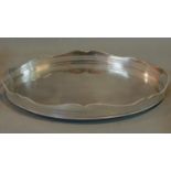 A large oval silver plated tray with wavy pierced gallery. 62x39cm