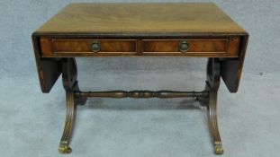 A small Regency style mahogany drop flap sofa table. H.53 W.114 D.51cm