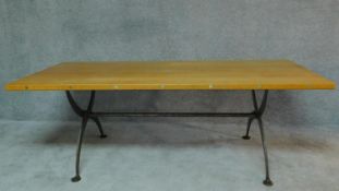 An oak topped refectory dining table on metal x frame support. H.74 W.209 D.90cm