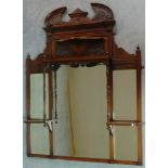 A Victorian carved walnut overmantel with broken arch pediment. H.135 W.111 D.16cm
