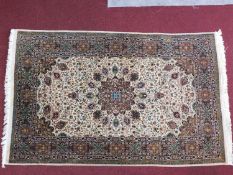 A Persian Isfahan part silk Nain rug with central medallion on an ivory field surrounded by floral