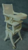 A late 19th century painted metamorphic child's high chair converting to a rocking chair. H.98cm