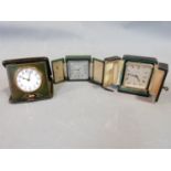 Three vintage travel clocks in gilded leather cases, silver plated and brass