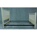 A white painted single bedstead in the Mackintosh style. H.137 H.202 D.109cm