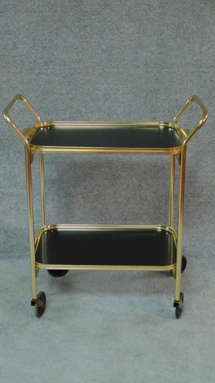 A 1970's vintage gilt metal two tier drinks trolley. H.81 W.70 D.38cm